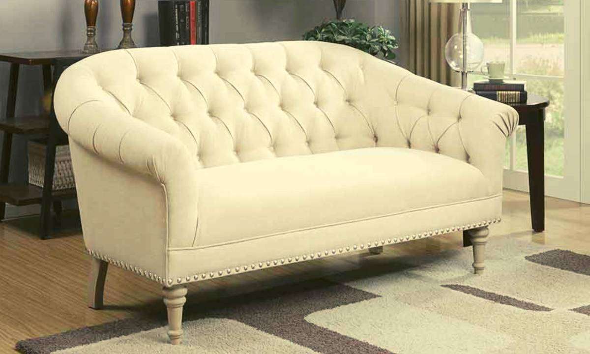 A white settee in a living room