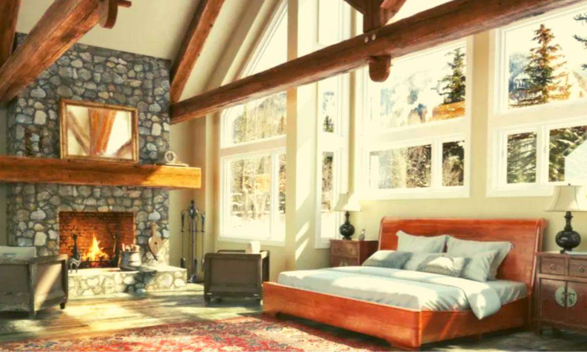A large bedroom with vaulted ceilings and a roaring fireplace.